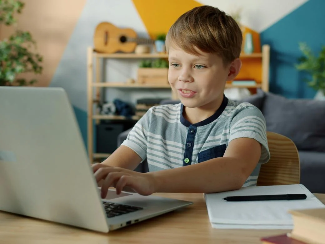 A child at a laptop at home
